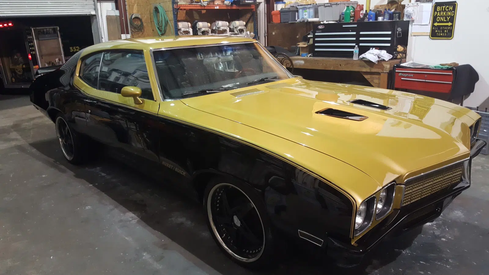 Polished black and gold classic muscle car inside a garage — Performance Mobile Detail in Ocala